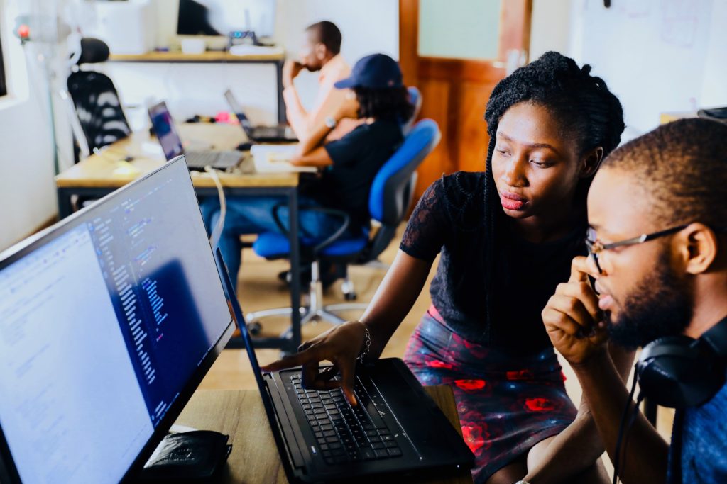 Man and woman looking at a laptop together